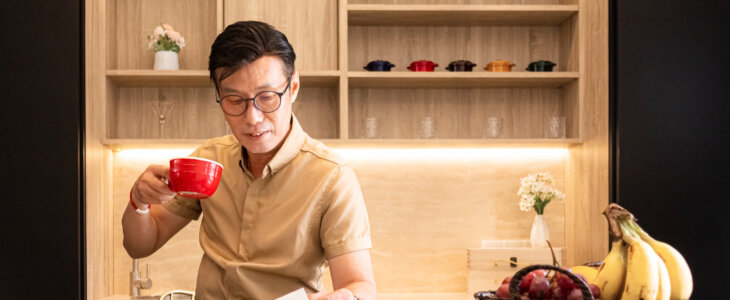 Man enjoys his coffee and reading magazine